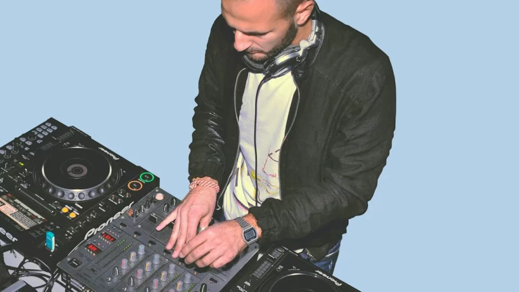 Man learning how to DJ